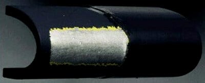 Comparison between polyurethane tape-protected area and erosion of unprotected area of aluminum substrate
