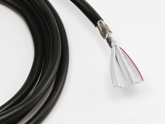Shielding and jacketing stripped back to expose the layers of the round twisted flat cable