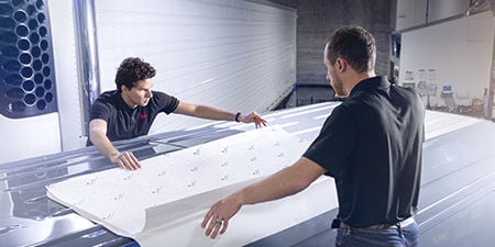 3M cooling film being applied to the roof of a fleet delivery vehicle.